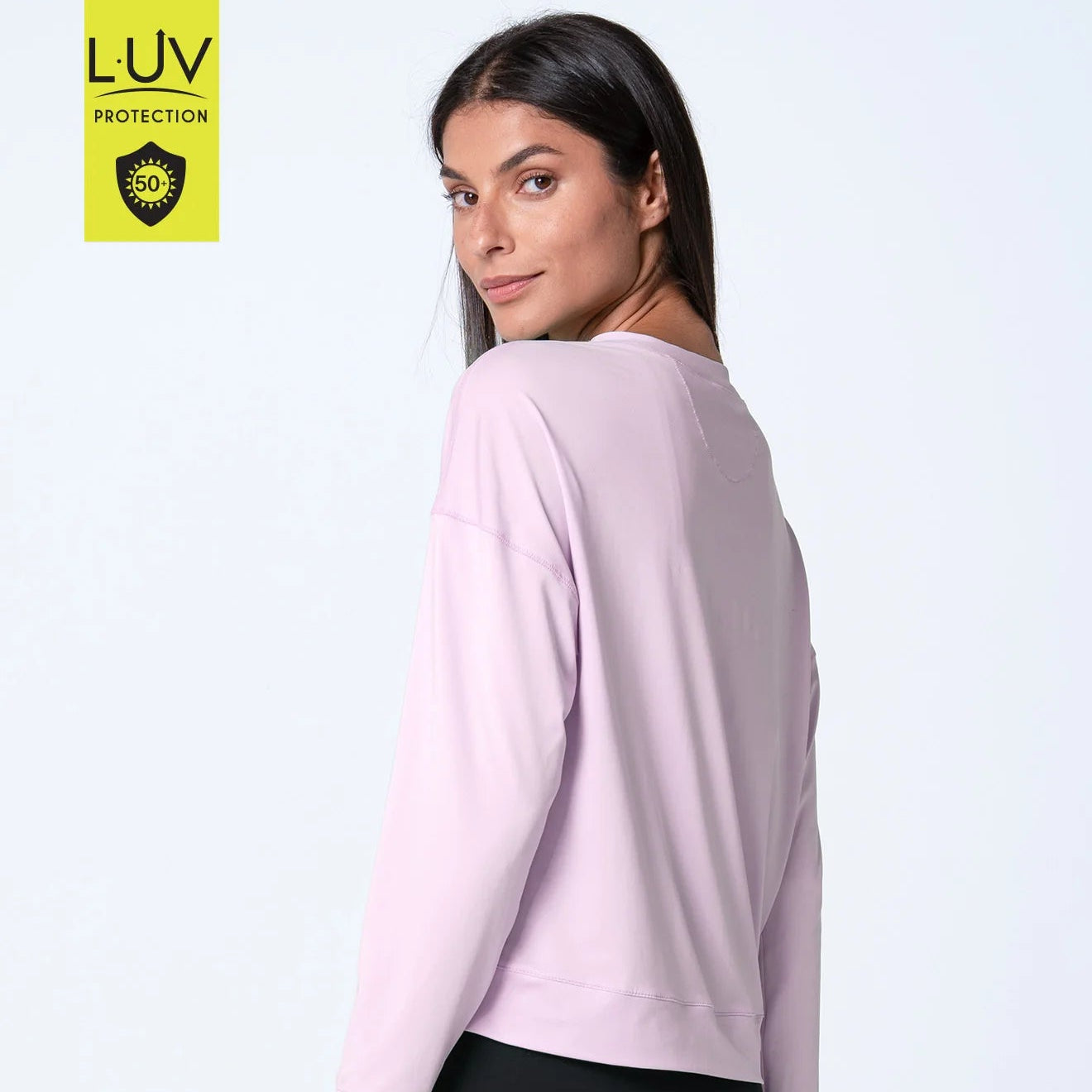 Side view of round neck, drop shoulder, pink sand long sleeve UPF 50+ for extra fun in the sun.