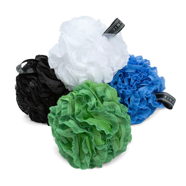 Four bath pouf loofahsa in black, white, green, and blue on a white background.
