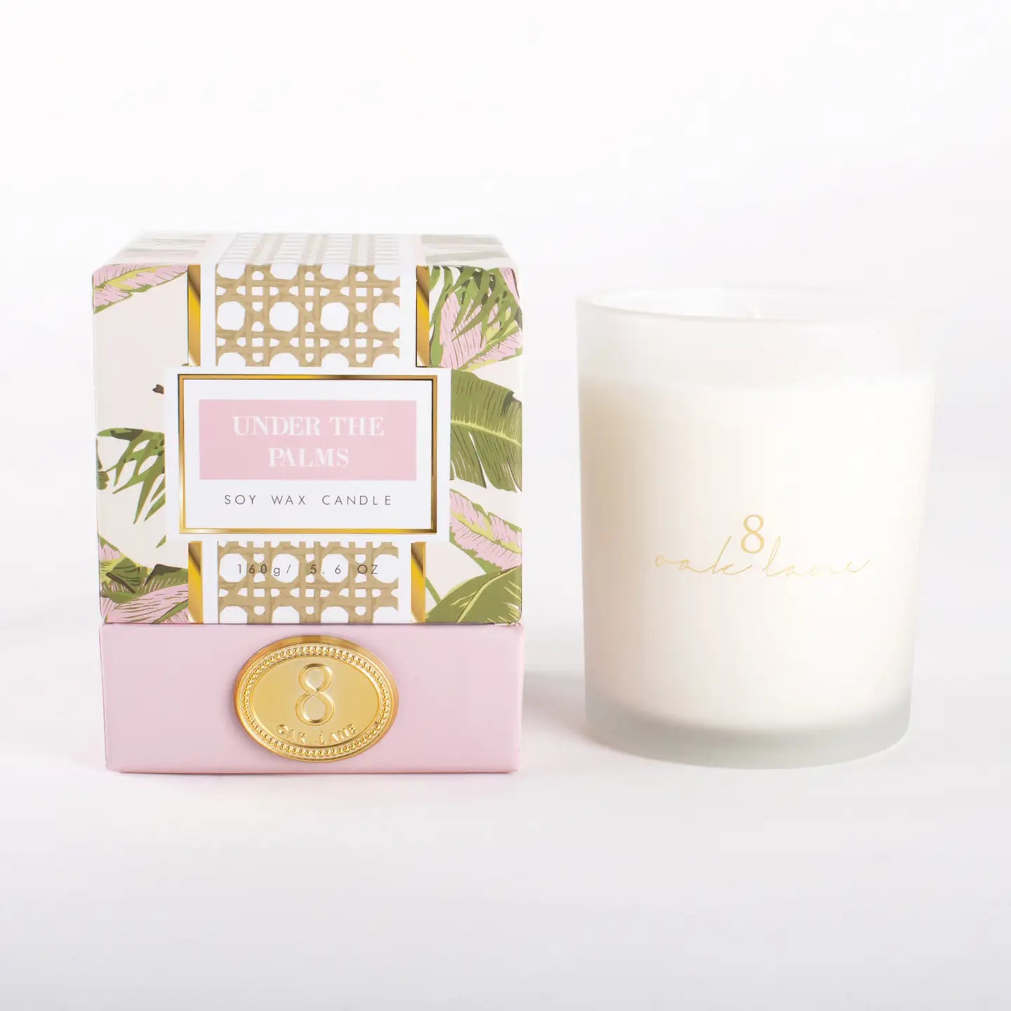 5.6oz Soy Wax Candle with the Scent of Grapefruit, Bergamot, packaging is a tropical pink and green.
