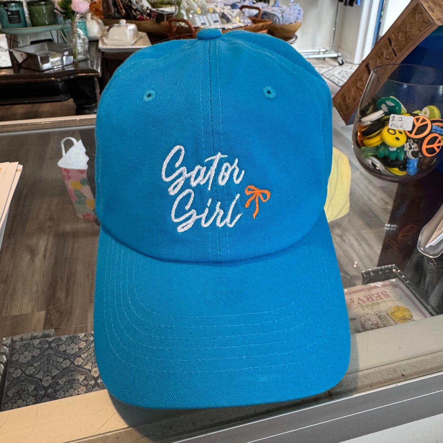 Blue cap with 'Gator Girl' embroidery on the front