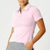 A woman wearing a pink short sleeve polo zip top with a zipper at the front, designed for tennis or pickleball.