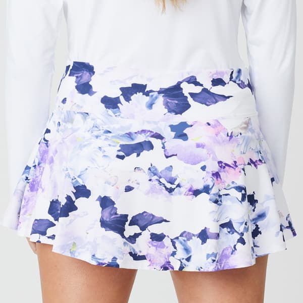 Back view of a skirt with a lilac and pink dream print, featuring a midi length and a stretchy fabric.