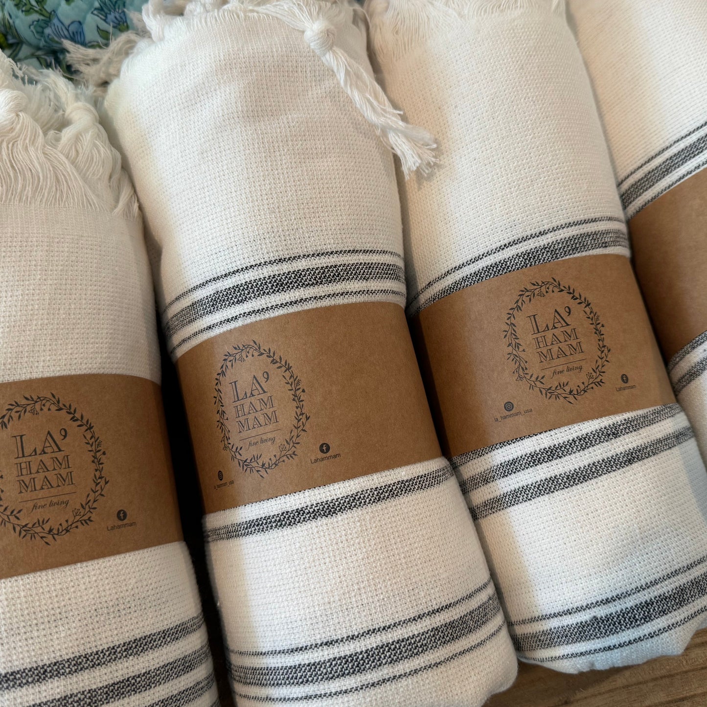 Rolled striped blue and white turkish towels.