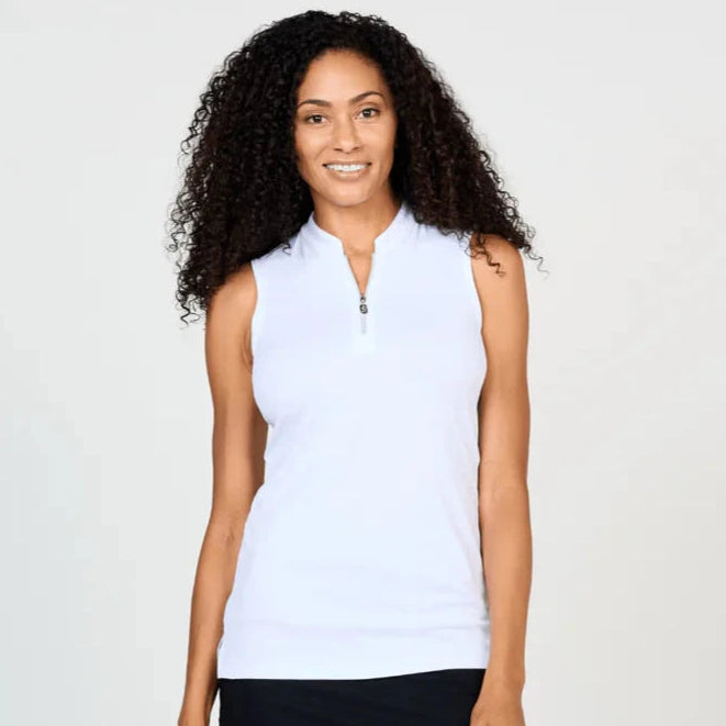 A woman wearing a white sleeveless Sofibella zip tank top.