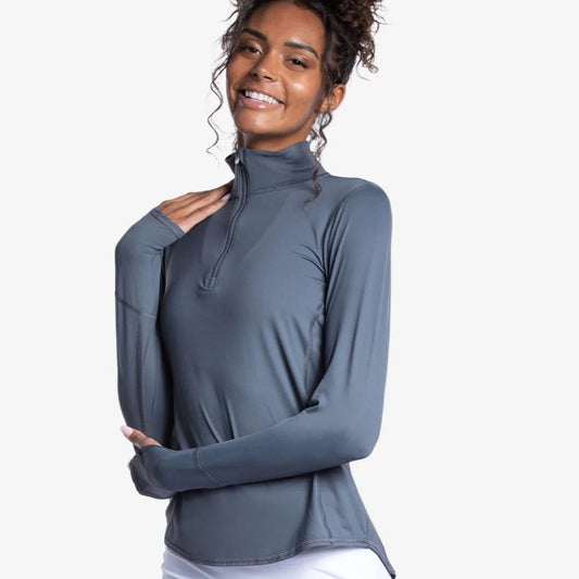 Woman wearing a grey long-sleeve top with a quarter zip, SPF 50 - Front