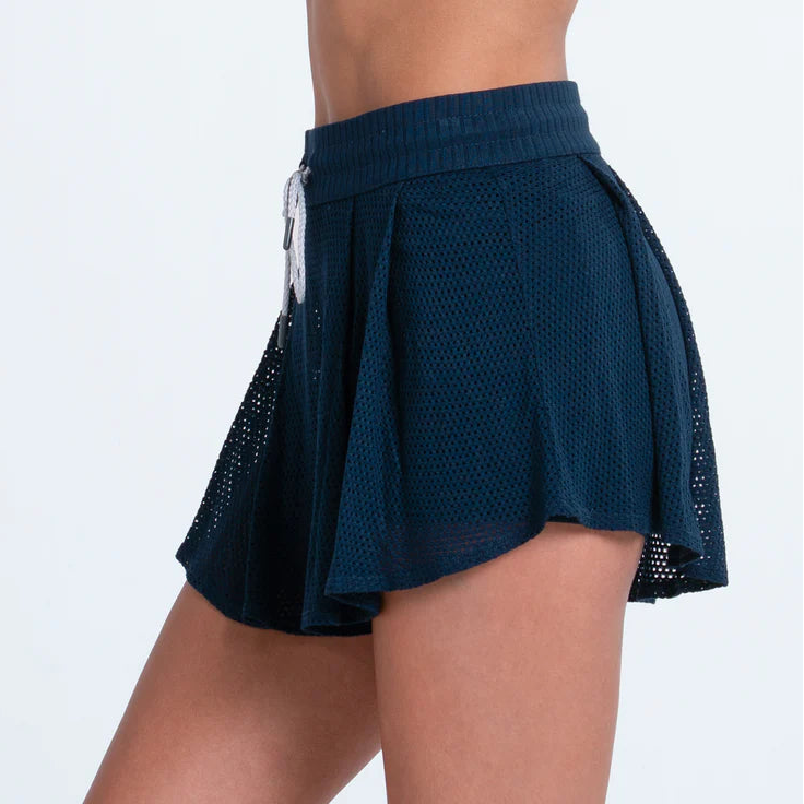 Side view of Navy blue Lucky in Love skirt with a white drawstring.