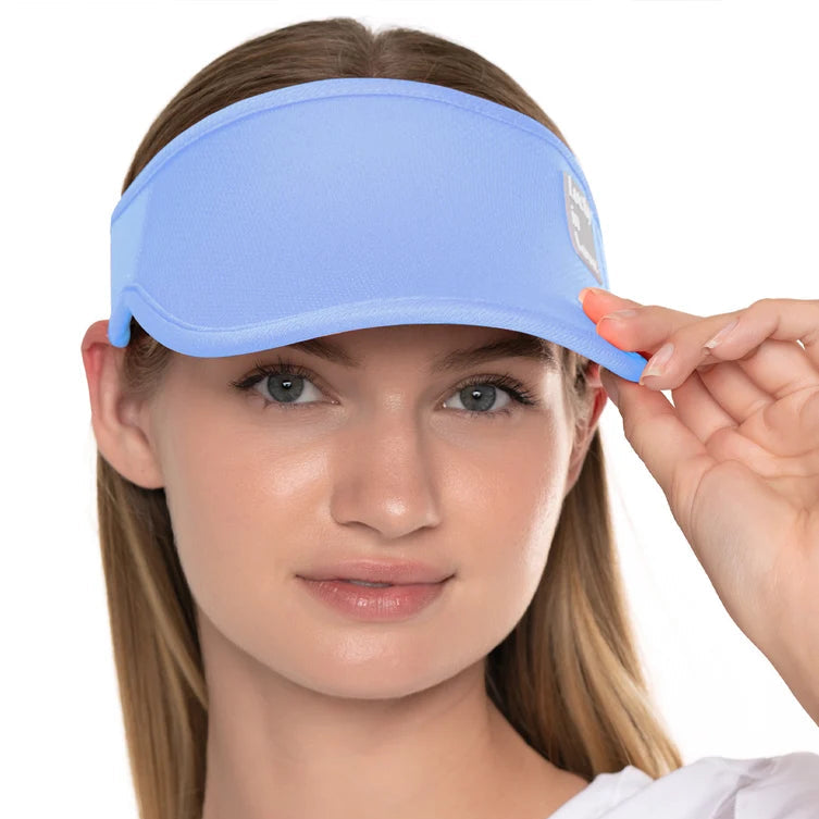 Woman wearing our cool blue performance visor. French terry fabric on the inside headband has moisture wicking.
