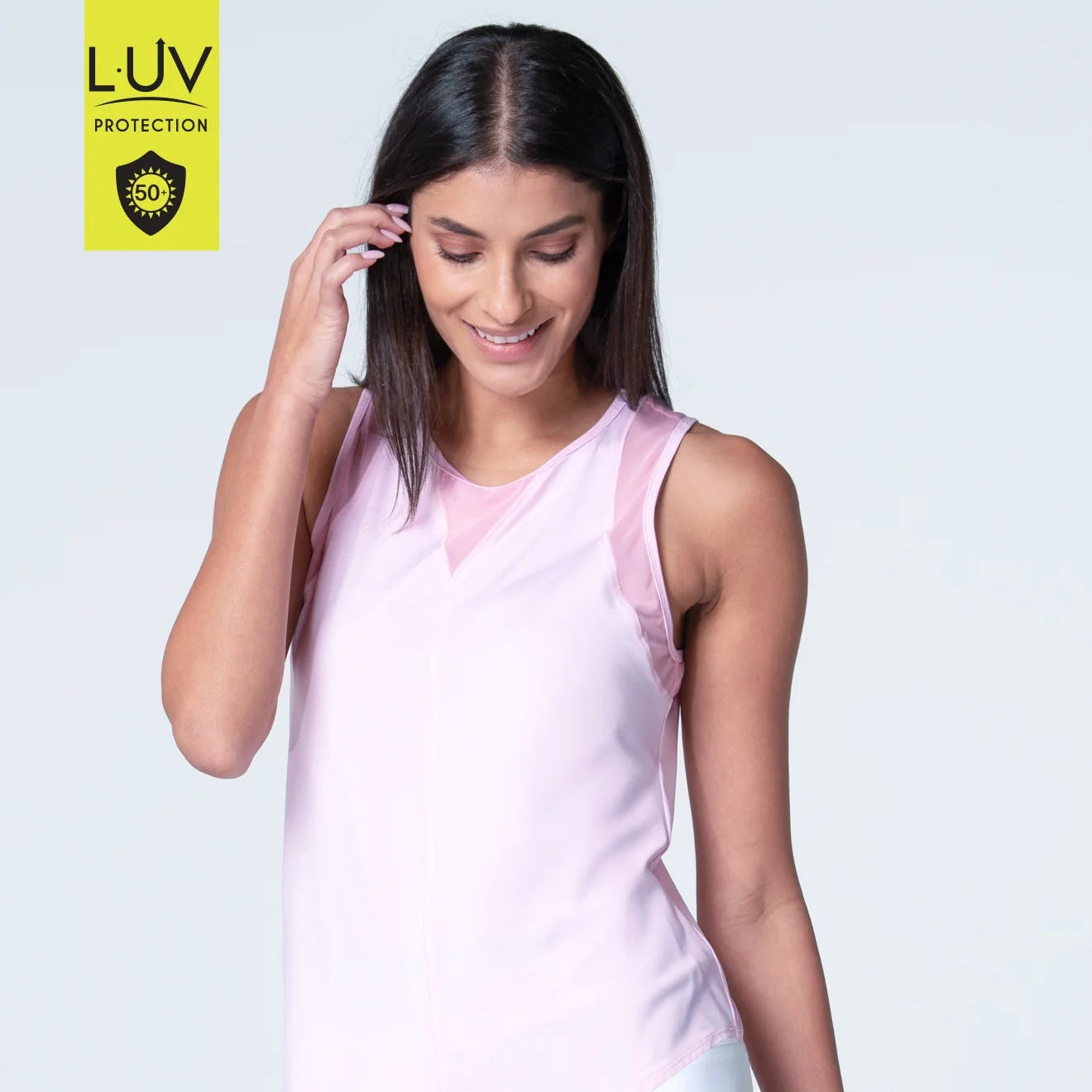 Front view of round neck, full back, pink sand tank is made from UPF 50+ super lightweight polyester