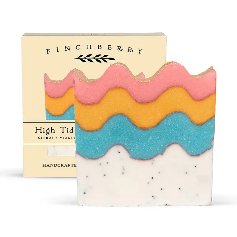Colorful soap bar with wavy layers and 'Finchberry' packaging on a white background
