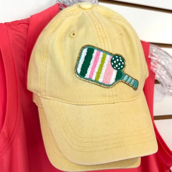 Yellow cap with a colorful pickleball paddle design