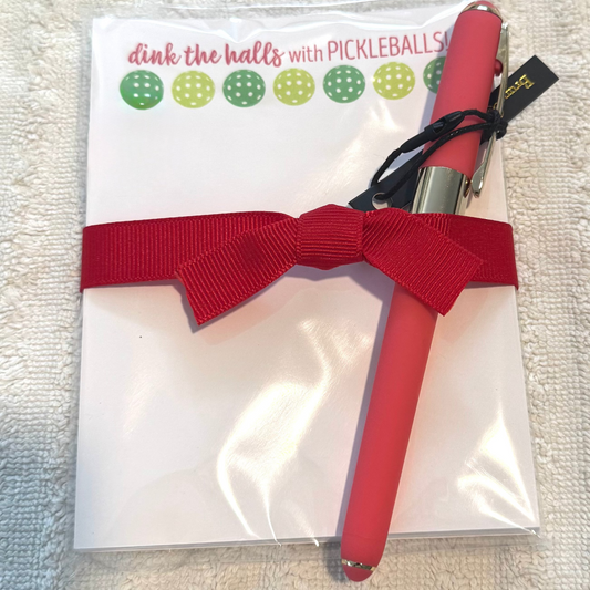 Dink the Halls with Pickleball notepad gift tied with black ribbon and comes with a white ballpoint pen by Bruno Visconti