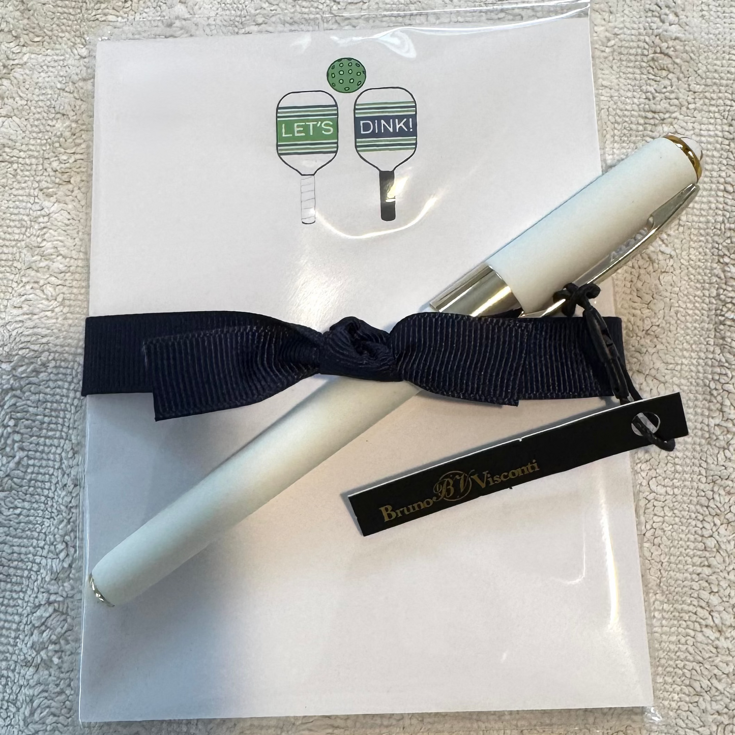 Let's Dink Pickleball inspired notepad gift tied with black ribbon and comes with a white ballpoint pen by Bruno Visconti
