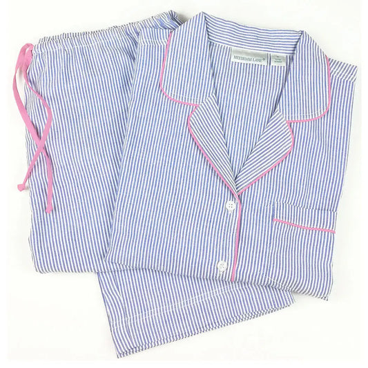 Women's blue and white striped pajama set with pink piping