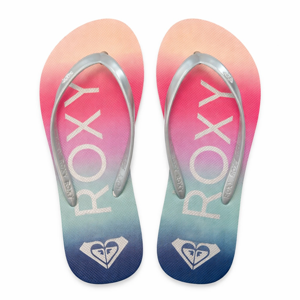 Sliver strapped Roxy flip flips with colorful footbed on white background