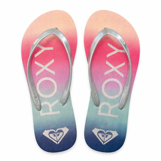 Sliver strapped Roxy flip flips with colorful footbed on white background