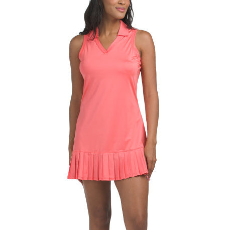 Woman wearing a coral tennis dress