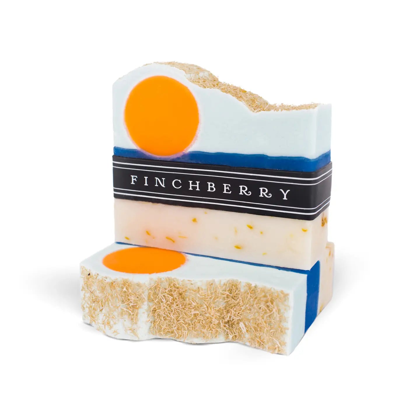Two stacked soap bars with orange centers and a visible brand label on a white background