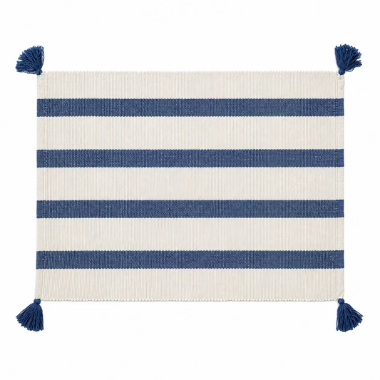 navy and white striped placemat with navy tassels on the corners