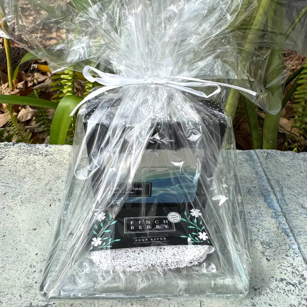 Fresh & Clean Finch Berry Boxed Soap with square glass soap dish sitting on Soap Saver wrapped as a gift set and tied with a bow.