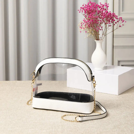 , this Solid Faux Leather Transparent Crossbody Bag features a sleek clear body, gold-tone chain strap, and faux leather trim. Ideal for concerts, events, and daily wear—fashion meets function in one chic design.