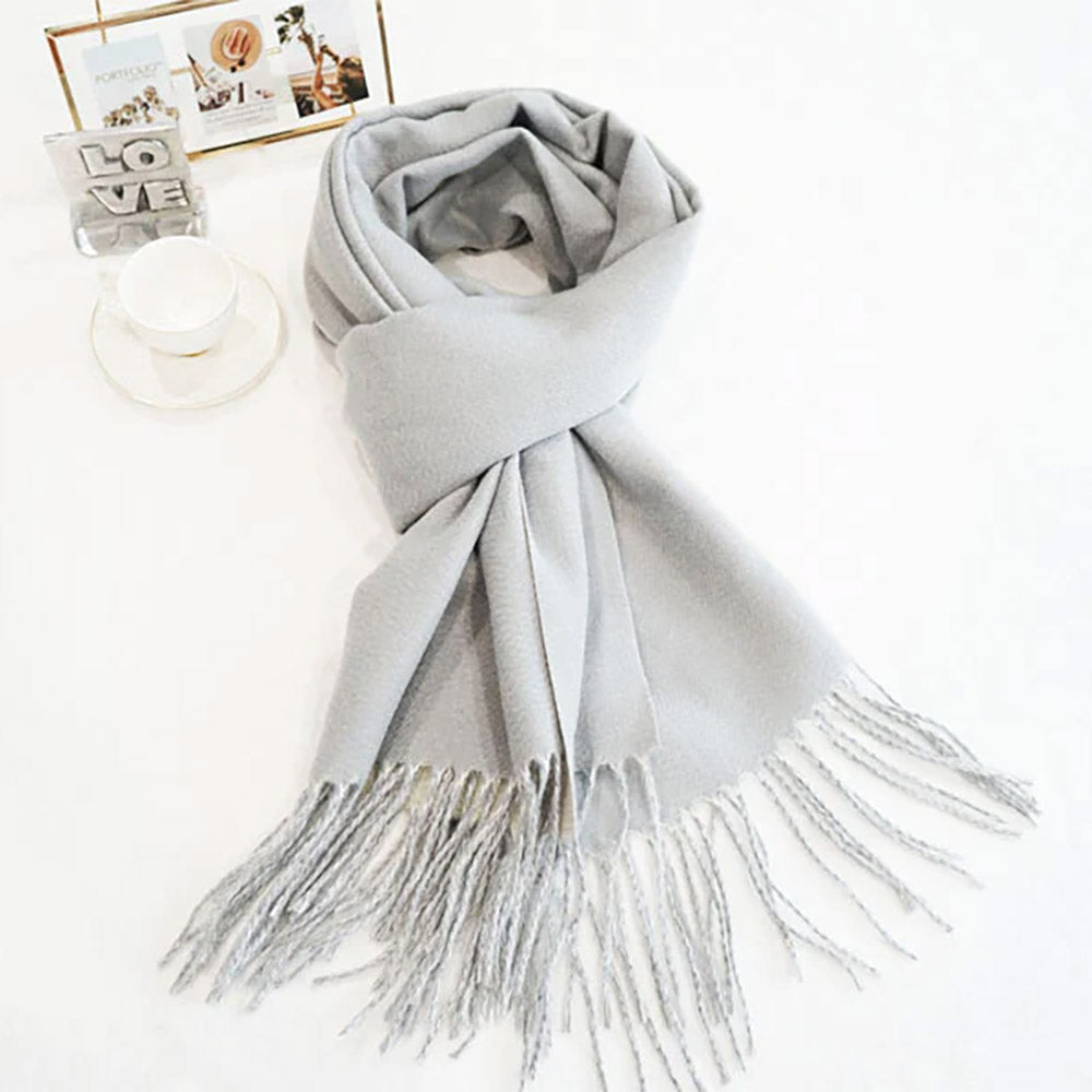 Light grey/off-white classic soft scarf featuring elegant fringe edges.