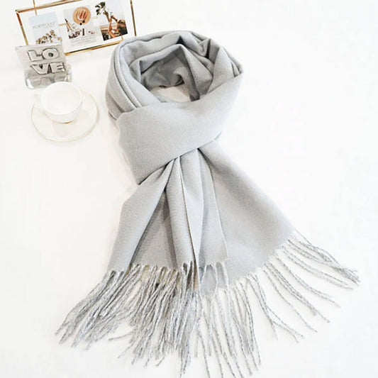 Light grey/off-white classic soft scarf featuring elegant fringe edges.