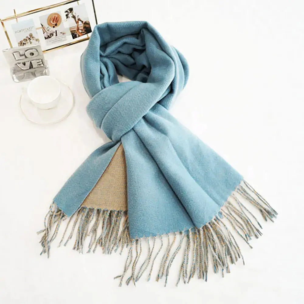 Light blue/beige classic soft scarf featuring elegant fringe edges.