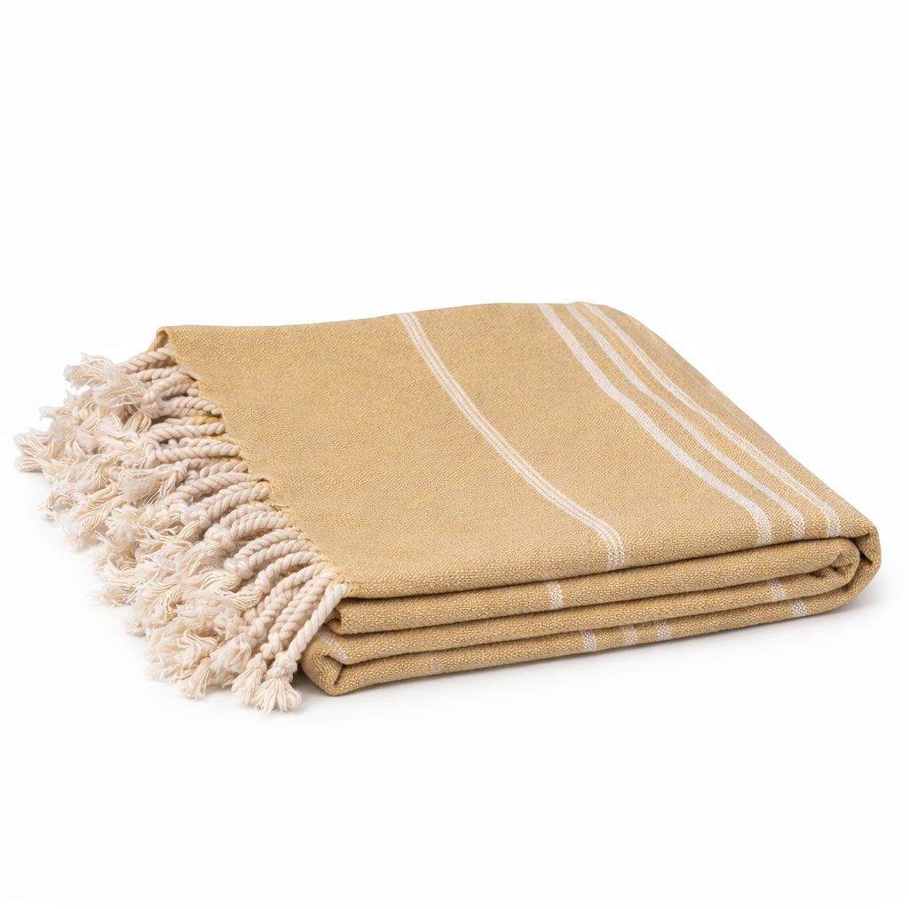 Mustard Beige towel with white stripes and tassels on a white background

