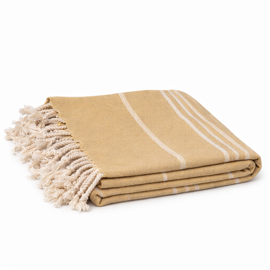 Mustard Beige towel with white stripes and tassels on a white background

