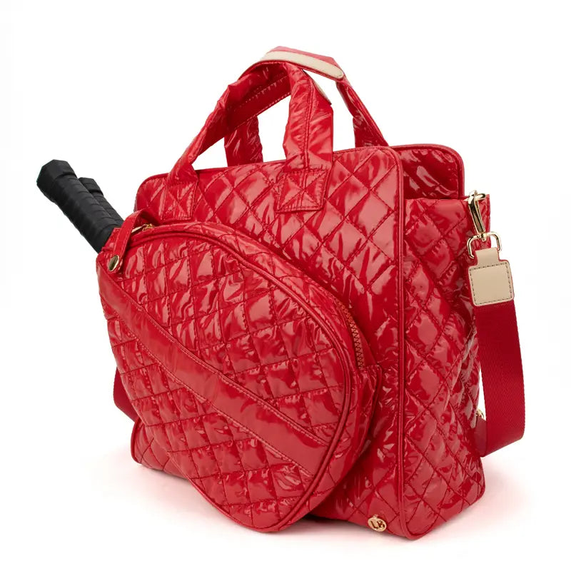 Side view of pickleball court tote with a dedicated racquet pocket and interior organizational compartments in cherry red
