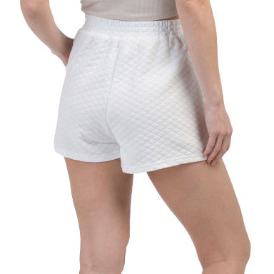 Back of woman wearing white shorts with a pickleball embroidered logo