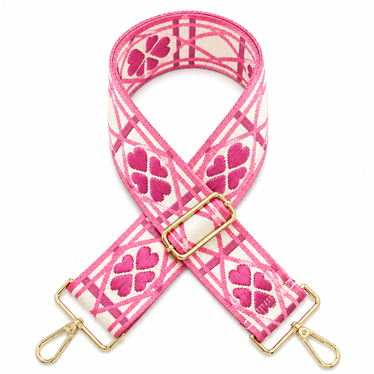 Pink and white patterned shoulder strap with gold-tone hardware,with quick-release buckles