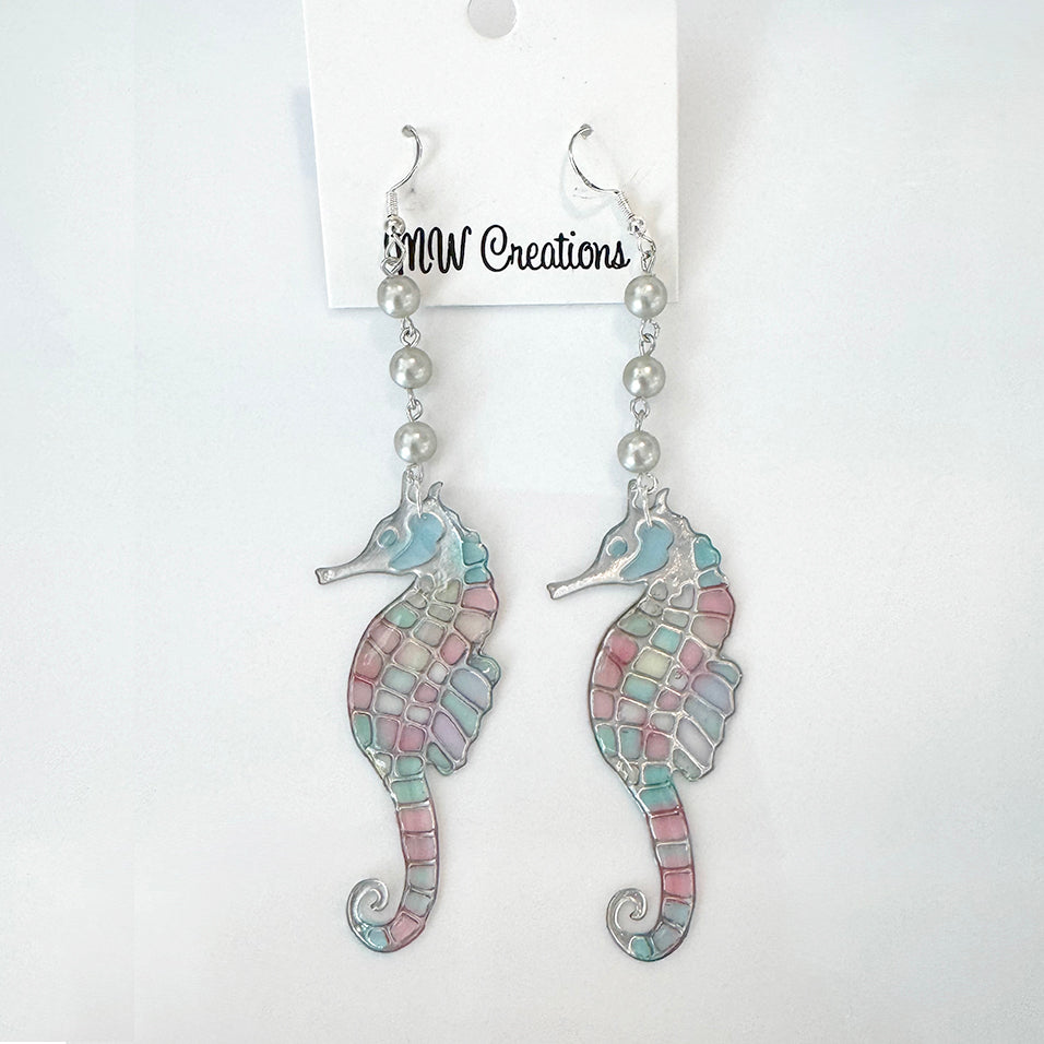 Pair of seahorse earrings with pearl beads on a MW Creations card.