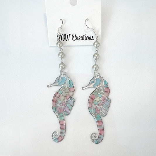 Pair of seahorse earrings with pearl beads on a MW Creations card.
