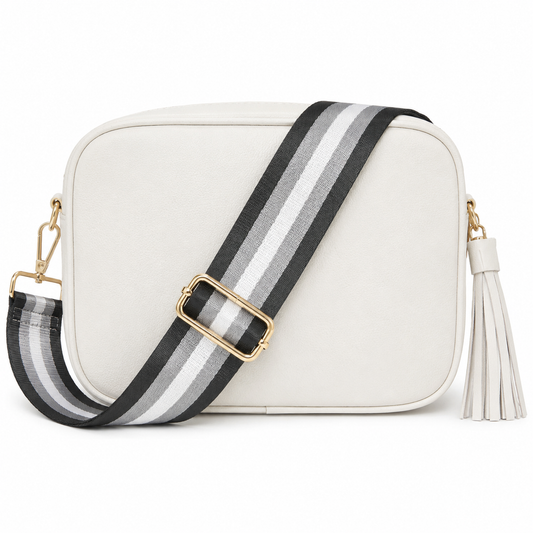 White camera bag purse with dark greay striped strap